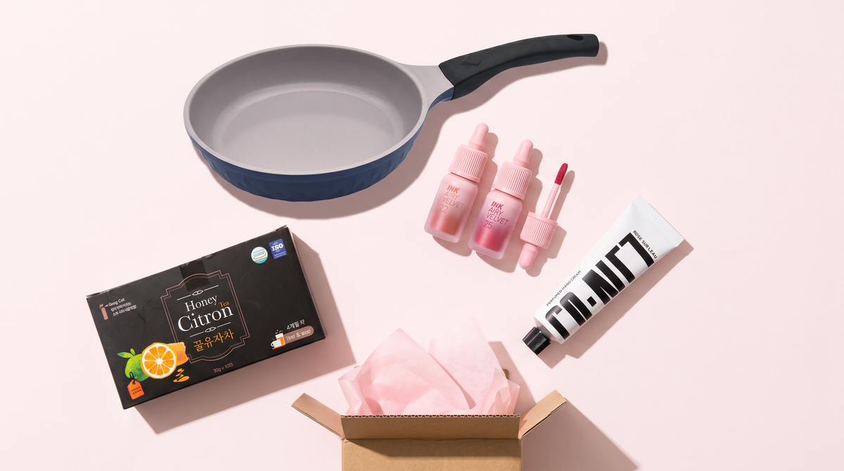 A KSHOP box with a ceramic pan, citron tea, a lip tint, and a hand cream