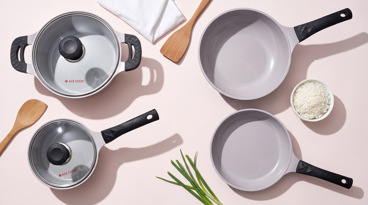 ACE COOK Korean ceramic frying pan, wok, saucepan and pot on a pink backdrop