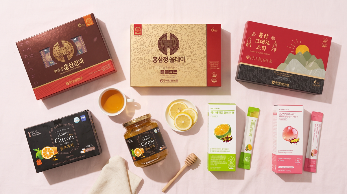 Korean red ginseng sticks, honeyed red ginseng, citron tea and FOODOLOGY ACV jelly sticks on a pink backdrop