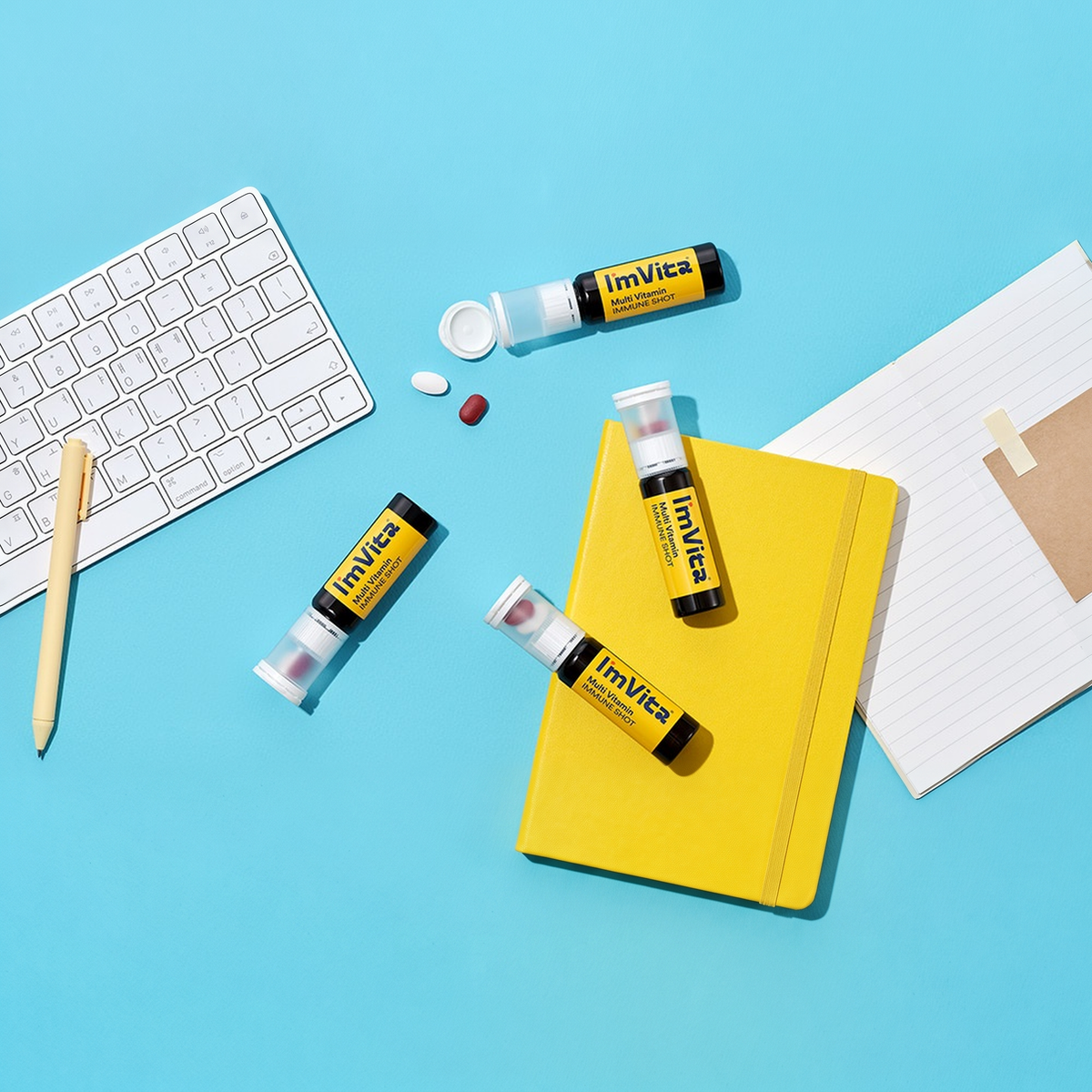 I'm Vita Multi Vitamin Immune Shot bottles on a desk