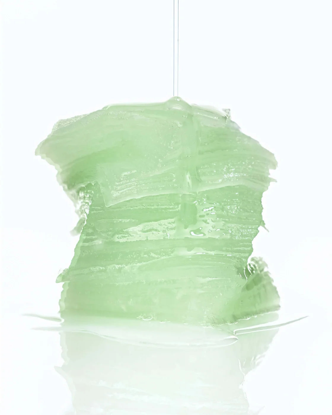 Stack of translucent green INFODPLUS Hydrovita Gel Pads