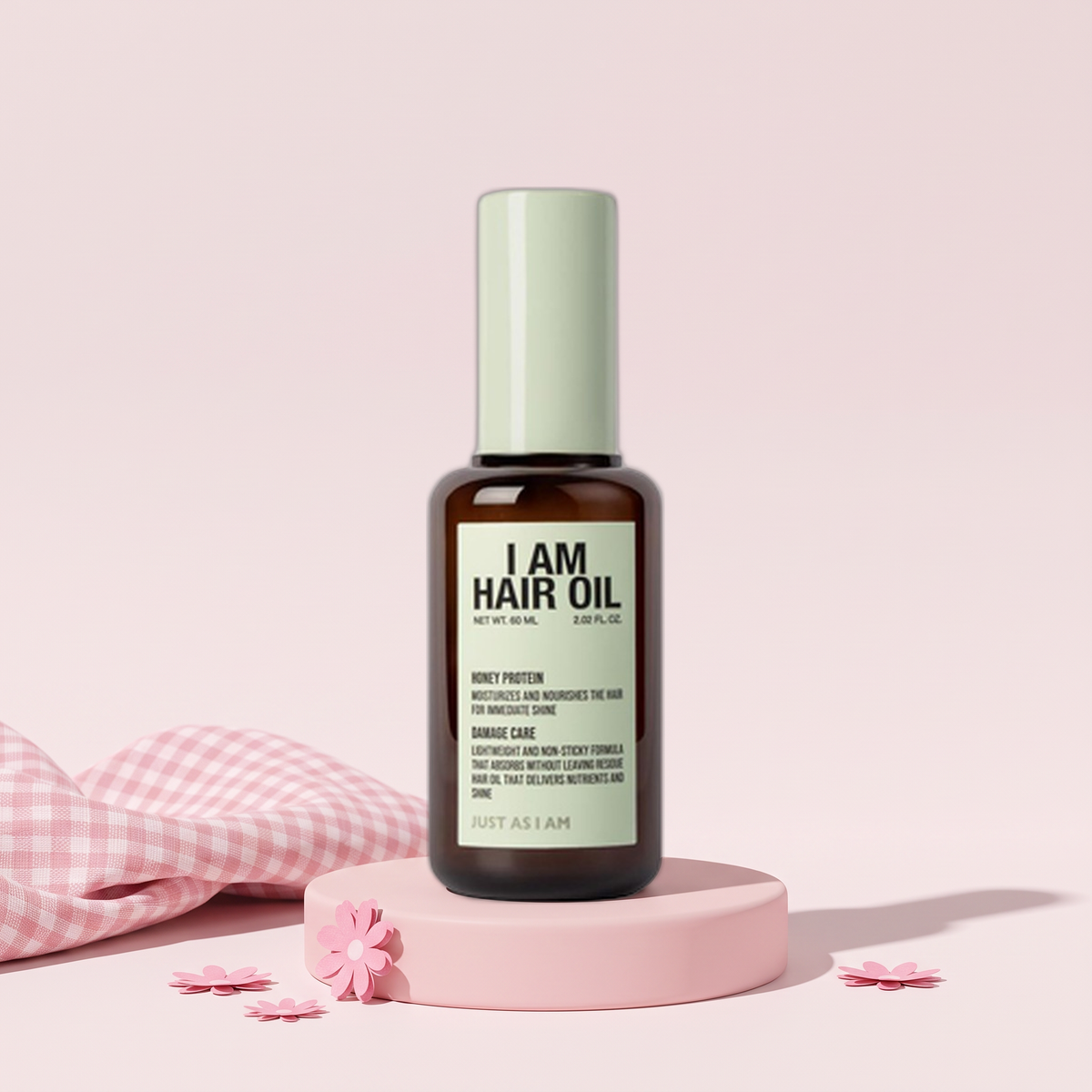 JUST AS I AM I Am Hair Oil, Honey Protein 2.02 fl oz (60 ml) on a pink plinth