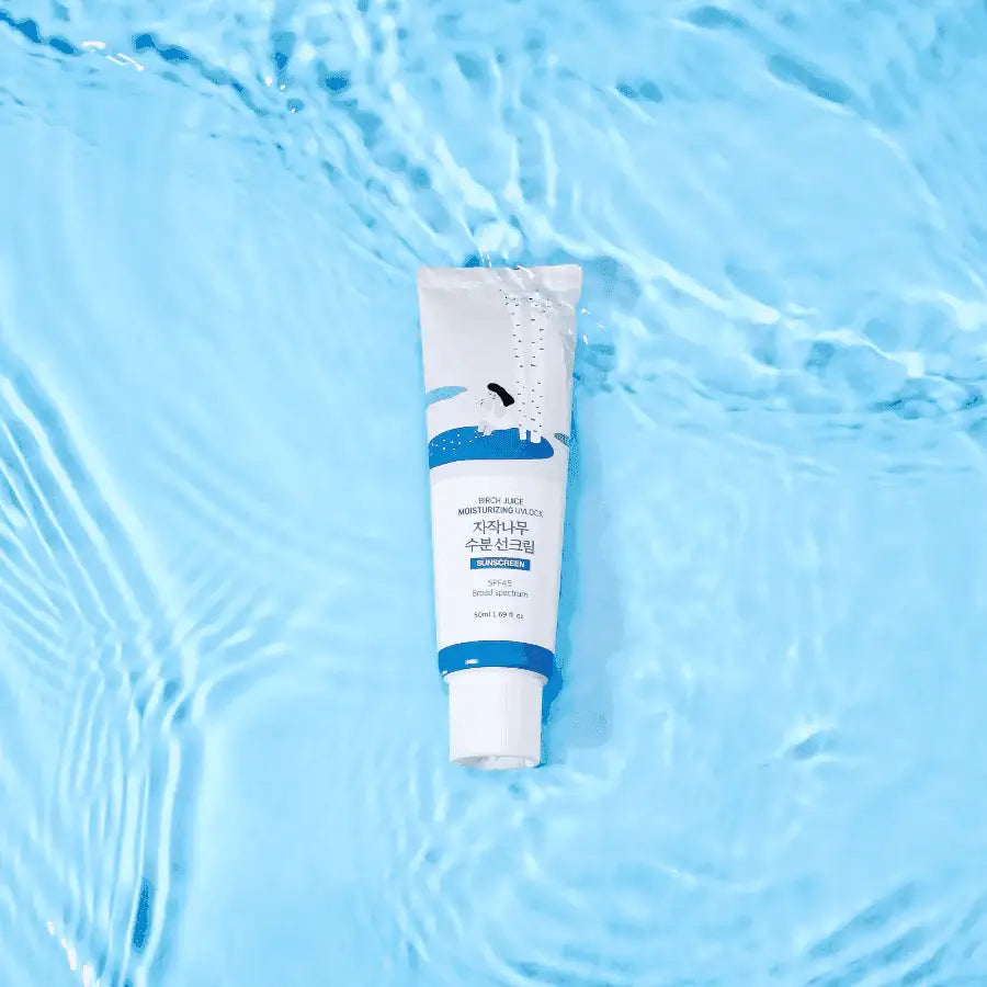 Birch Juice Moisturizing Sunscreen tube floating on water