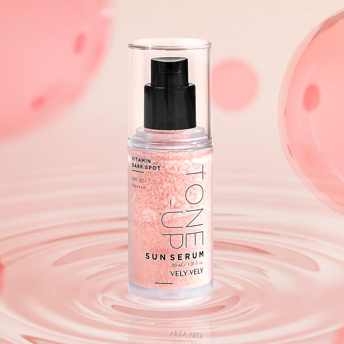 Tone-Up Sun Serum bottle showing the pink capsule texture