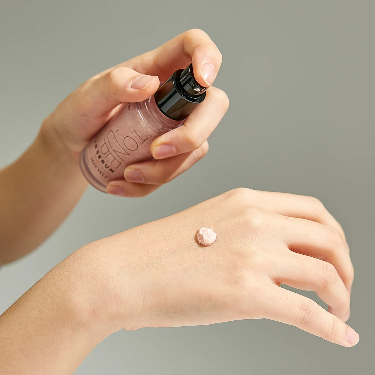 Tone-Up Sun Serum swatch on the back of a hand